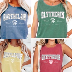 May include: Four sleeveless tank tops in blue, green, yellow, and red. Each top features a different house name from a wizarding school: Ravenclaw, Slytherin, Hufflepuff, and Gryffindor, with the school crest and the words "Wizard League".