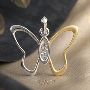 Peut inclure: Ensemble de trois tasses en céramique avec une finition mate et mouchetée. Les tasses sont dans des tons crème, gris clair et gris foncé. Chaque tasse a un design simple et minimaliste, parfait pour le café ou le thé.