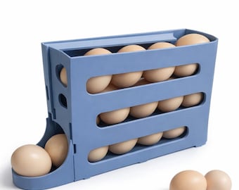 May include: A blue plastic egg holder with three tiers, each holding several brown eggs. The holder has a curved design and a small tray at the bottom. Several loose eggs are scattered around the holder.
