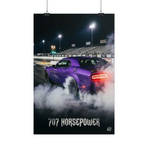 May include: A purple muscle car performing a burnout on a drag strip at night, surrounded by thick white tire smoke. The car features glowing red taillights. The text 707 HORSEPOWER is printed in a bold, distressed font at the bottom of the image.