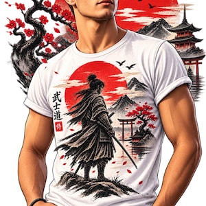 May include: A white t-shirt featuring a graphic print of a samurai standing with a sword. The design includes a large red sun, a pagoda, a torii gate, and cherry blossom trees. Japanese characters are printed vertically on the left side.