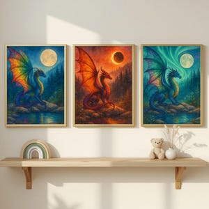 May include: Three framed fantasy art prints featuring dragons. Each print showcases a dragon with colorful wings, set against a backdrop of a forest, moon, and celestial elements. The dragons are in shades of blue, red, and green.