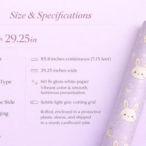 May include: A roll of wrapping paper with a repeating pattern of cute bunny faces and crescent moons on a light purple background. The paper is 29.25 inches wide and 85.8 inches long.