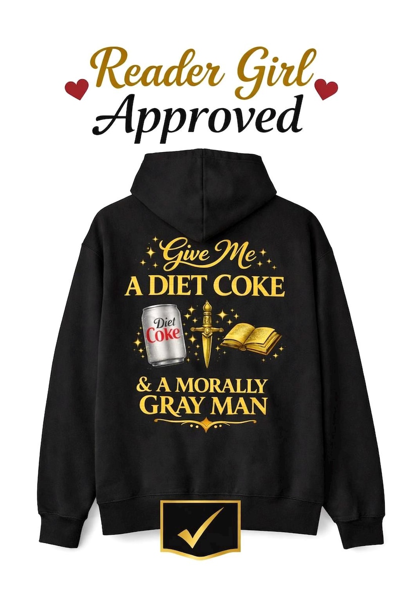 May include: Black hoodie with the text "Give Me A Diet Coke & A Morally Gray Man." The design includes a Diet Coke can, a sword, and a book. The words "Reader Girl Approved" are at the top.