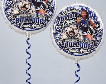 May include: Two round silver foil balloons featuring a photo of a cheerleader, a bulldog mascot, and text reading Deiondra Smoot Cheer, Winterboro High School Bulldogs, and Senior Night. Each balloon is attached to a dark blue curling ribbon.