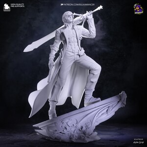 May include: A monochromatic gray resin figurine of a standing character wearing a long coat, holding a handgun in one hand and resting a large sword across the shoulders. The figure stands on a decorative base featuring skull motifs and textures.