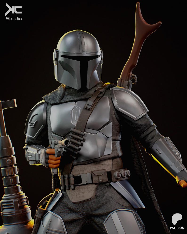 May include: A detailed figure of a Mandalorian warrior in silver and black armor, holding a blaster pistol. The figure has a helmet, shoulder armor, and a utility belt. A rifle is attached to the back. The KC Studio logo is in the top left corner.