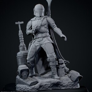 May include: A gray resin render of The Mandalorian action figure, standing on a rocky base with Grogu. The figure is holding a blaster, with a rifle on its back. The image includes the text "1/6th Scale Resin Render" and "23 STL Parts".