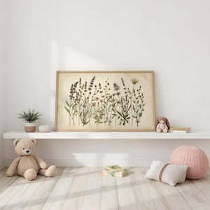 May include: A rectangular framed wall art print featuring a botanical illustration of various wildflowers and grasses in muted green, brown, and cream tones. The artwork is displayed in a light-colored wooden frame, showcasing a detailed arrangement of stems.