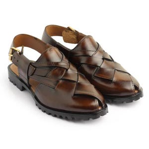Handmade burnished brown leather for men featuring a woven closed-toe upper, adjustable slingback buckle, peep-toe design, and rugged lug sole, ideal for summer, vacations, walking, and smart casual wear.
