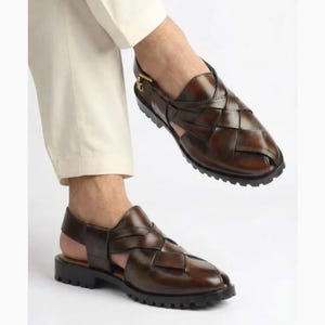 Handmade burnished brown leather for men featuring a woven closed-toe upper, adjustable slingback buckle, peep-toe design, and rugged lug sole, ideal for summer, vacations, walking, and smart casual wear.