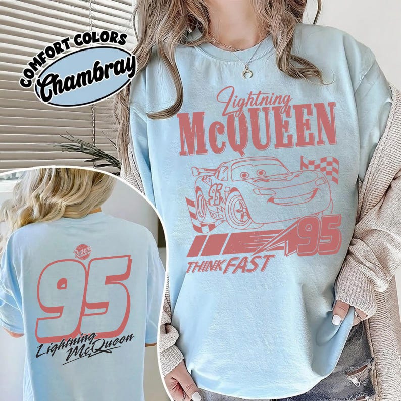 May include: Light blue t-shirt featuring Lightning McQueen graphic with the number 95 and the text "Think Fast". The back of the shirt also displays the number 95 and "Lightning McQueen".