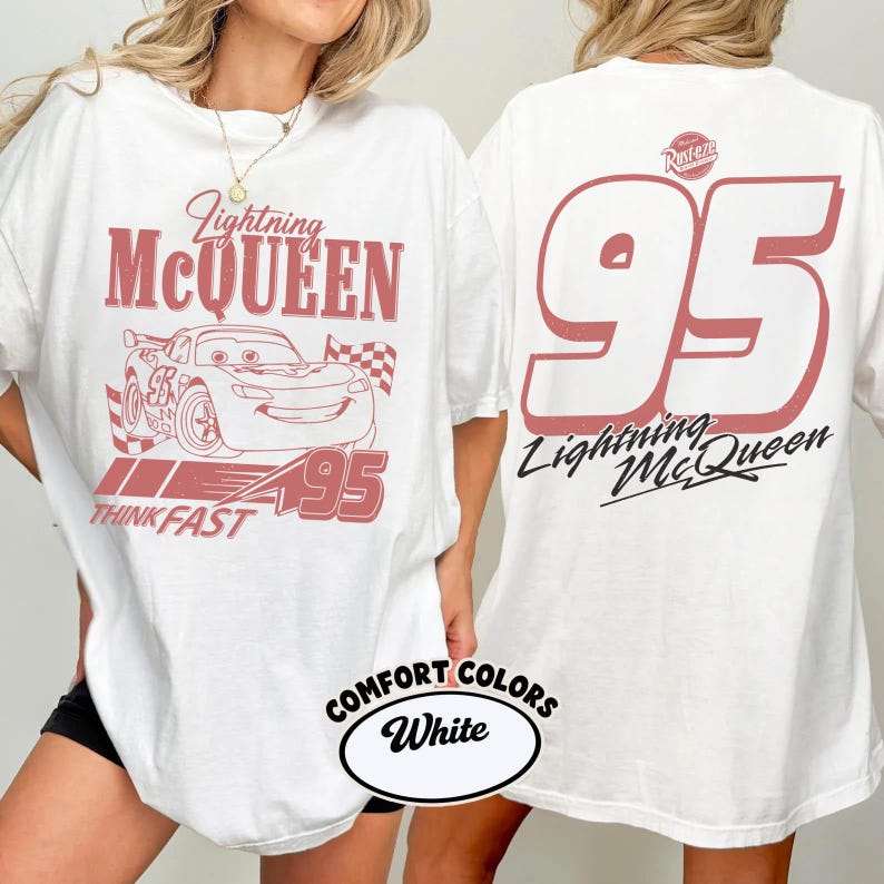 May include: White t-shirt featuring a red graphic of Lightning McQueen, the number 95, and the text "Think Fast." The back of the shirt displays a large number 95 and the words "Lightning McQueen."