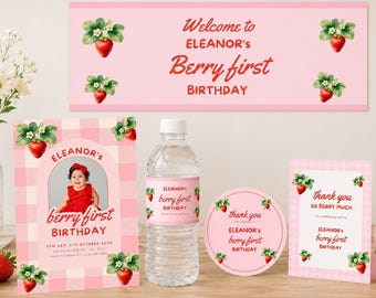 May include: A strawberry-themed birthday party set featuring a pink banner, a rectangular invitation with a photo of a child, a water bottle with a custom label, a round sticker, and a thank you card, all decorated with red strawberry illustrations.