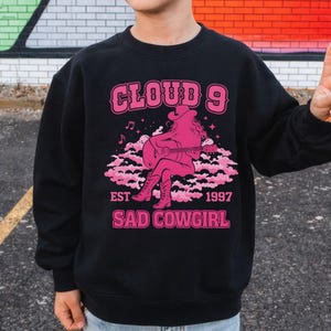 May include: A set of three ceramic mugs with a speckled, matte finish in blue, green, and white. Each mug has a simple, modern design, suitable for coffee or tea. The mugs are stacked on top of each other.