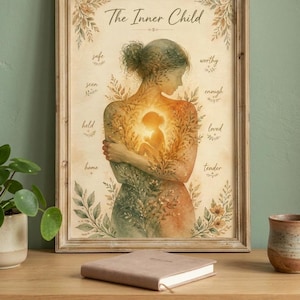 May include: A framed wall art print titled The Inner Child, featuring a watercolour illustration of a person embracing a glowing, radiant child figure within their torso, surrounded by botanical elements and the words safe, seen, held, home, worthy, enough, loved, and tender.