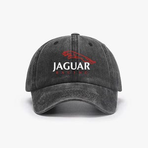 Puede incluir: Gorra de béisbol negra con el texto "JAGUAR RACING" en blanco y un logotipo de jaguar rojo. La gorra tiene una visera curva y una correa ajustable.