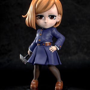 May include: A figurine of a character with short, light brown hair, wearing a dark blue uniform with a pleated skirt and brown shoes. The figure is holding a small hammer and stands on a black base.