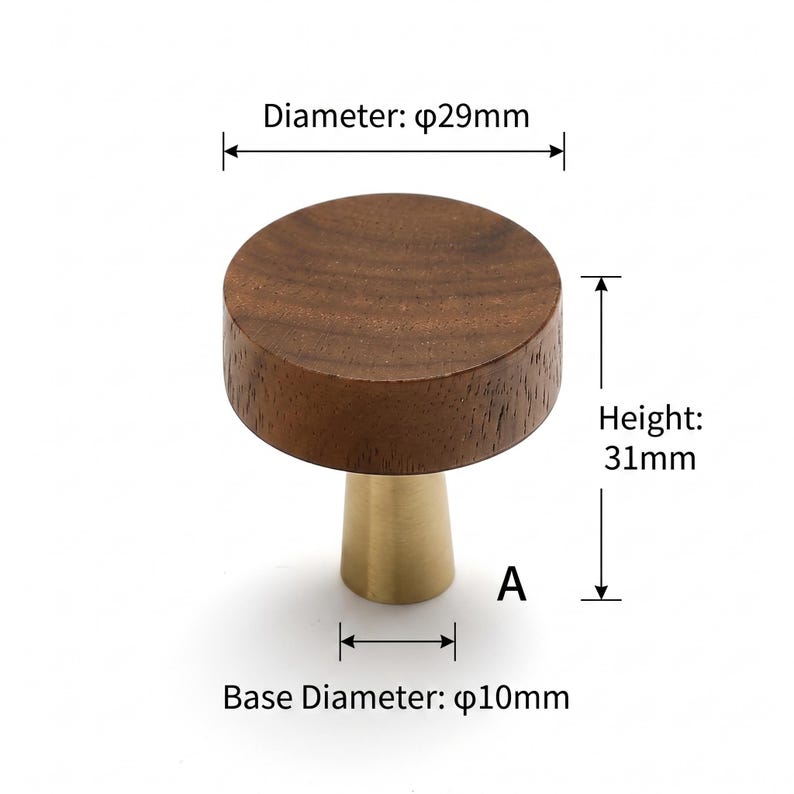 May include: A round wooden cabinet knob with a dark brown wood grain top and a brushed gold metal conical base. Technical labels indicate a diameter of 29mm, a height of 31mm, and a base diameter of 10mm. The letter A is printed near the base.