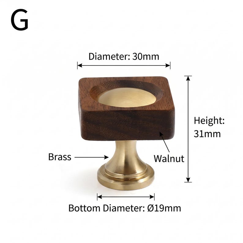 May include: A square cabinet knob featuring a dark brown walnut wood top with a circular brass centre inlay, mounted on a brass base. The knob has a diameter of 30mm, a height of 31mm, and a bottom diameter of 19mm, labelled with G.