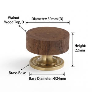 May include: A cabinet knob featuring a circular walnut wood top and a brass base. The knob has a diameter of 30mm, a height of 22mm, and a base diameter of 24mm. The text labels Walnut Wood Top, D, Diameter: 30mm (D), Height: 22mm, Brass Base, and Base Diameter: &Phi;24mm are visible.