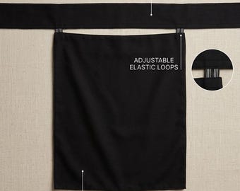 May include: A black apron featuring a wide tie band, a double-layer panel, and adjustable elastic loops. The image includes text labels identifying the wide tie band, adjustable elastic loops, and the double-layer panel construction.