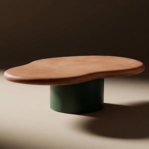 May include: A modern coffee table with a freeform, light brown top and a dark green cylindrical base. The table's top has a unique, organic shape, and the base provides a sturdy foundation. The design is minimalist and contemporary.
