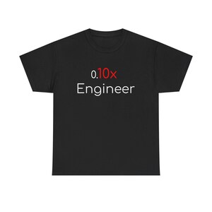 May include: Black t-shirt with the text "0.10x Engineer" printed in white, with the "0.10x" in red. The shirt is a crew neck style and appears to be made of a soft material.