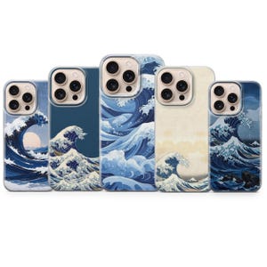 May include: Five mobile phone cases arranged in a row, each featuring a variation of the Great Wave off Kanagawa print. The designs display blue and white ocean waves, foam, and sea spray, with some cases showing a pale sun or mountain background.
