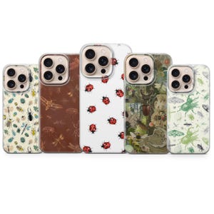 May include: Five smartphone cases featuring insect-themed designs. The first has a cream background with various colorful bugs. The second is brown with etched insect outlines. The third is white with red ladybugs. The fourth shows a detailed forest scene with beetles. The fifth is green with moth and beetle illustrations.