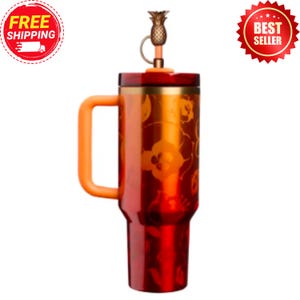 May include: A red and orange insulated travel mug with a handle. The mug has a floral pattern and a pineapple-shaped lid. The handle and lid accents are orange. Designed to keep drinks hot or cold, it is suitable for travel.