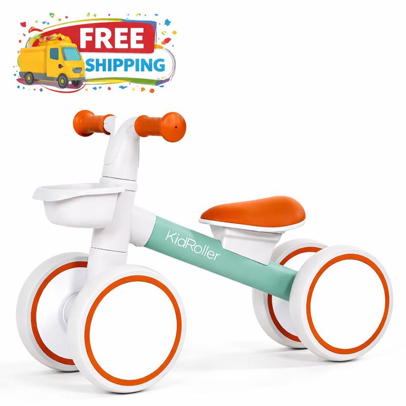 May include: A white and orange KidRoller balance bike for toddlers. The bike has a white frame with orange accents on the wheels, handlebars, and seat. The bike also has a small white basket in the front. The text "KidRoller" is printed on the frame.