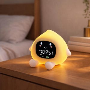 May include: A white ceramic mug with a black handle and the text "But First, Coffee" in a handwritten style. The mug is on a white surface. The mug is approximately 4 inches tall.