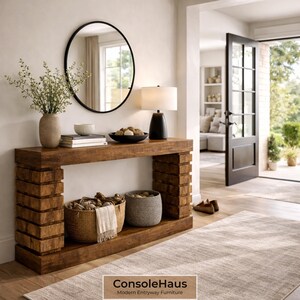 May include: A wooden console table with a black lamp, a round mirror, and decorative items. Two baskets sit below the table. The text "ConsoleHaus Modern Entryway Furniture" is at the bottom.
