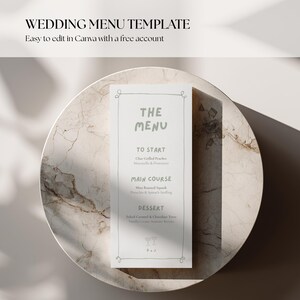 May include: A vertical wedding menu template printed on white paper with a thin grey border and decorative corners. The text includes headings for The Menu, To Start, Main Course, and Dessert, with two small wine glass icons at the bottom.