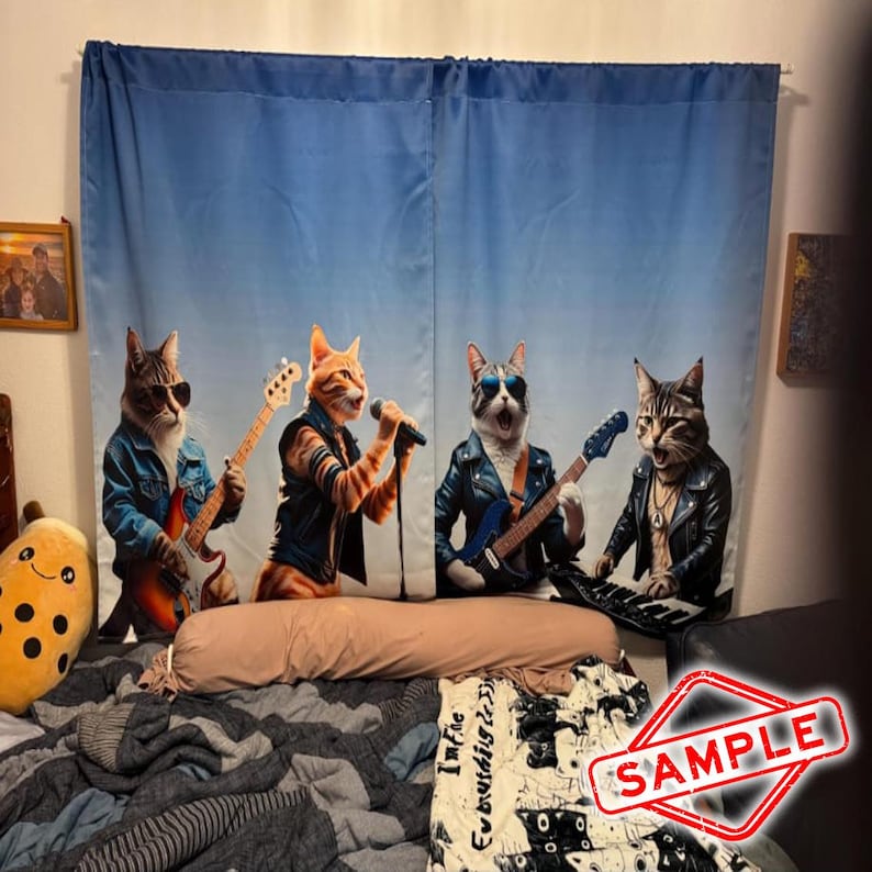 May include: Blue curtain featuring a band of four cats dressed in rock and roll attire. One cat sings into a microphone, while the others play guitar and keyboard. The cats are set against a gradient blue backdrop.
