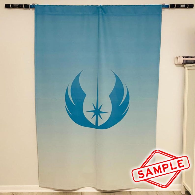 May include: A blue and white gradient curtain with a large blue emblem featuring a starburst design. The curtain is hanging from a black rod. The word "SAMPLE" is stamped in a red diamond shape in the lower right corner.