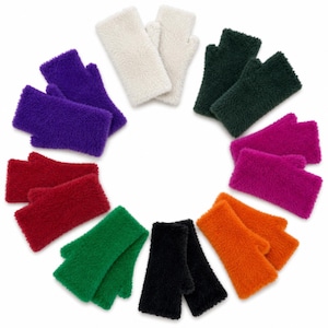 May include: A collection of fingerless gloves arranged in a circle, featuring pairs in white, dark green, magenta, orange, black, bright green, red, and purple. Each pair is crafted from a fuzzy, textured material with a thumb opening.