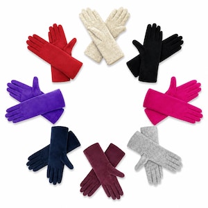 May include: A collection of eight pairs of gloves arranged in a circle, featuring solid colours including red, beige, black, magenta, grey, burgundy, navy blue, and purple. Each pair is made of a soft, fleece-like material with a standard five-finger design.