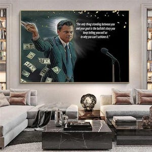 May include: A rectangular wall art print featuring a man in a pinstripe suit pointing forward with floating dollar bills and a microphone. The text reads: The only thing standing between you and your goal is the bullshit story you keep telling yourself as to why you can't achieve it.