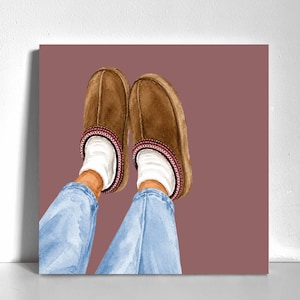 May include: A pair of brown suede slippers with a dark red stitched trim, worn over white socks and light blue denim jeans. The illustration features a solid mauve background, capturing the cozy footwear and casual leg attire in a simple style.