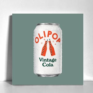 May include: A silver aluminum beverage can with condensation droplets on the surface. The label features the orange text OLIPOP, an illustration of two orange bottles with black and white striped straws, and the green text Vintage Cola.