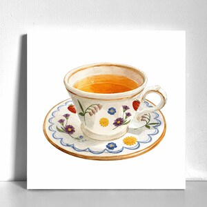 May include: A watercolour illustration of a white ceramic teacup and saucer filled with amber tea. The set features a hand-painted pattern of small red strawberries, yellow daisies, purple cornflowers, and blue forget-me-nots with scalloped edges.