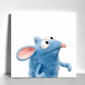 May include: A square wall art print featuring a watercolor illustration of a fuzzy blue creature with large white eyes, a small pink nose, and prominent pink-lined ears. The character is depicted from the chest up against a plain white background.