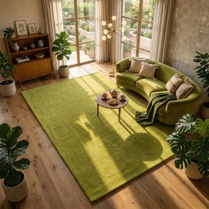 May include: A bright, lime green area rug dominates the room, complemented by a matching curved sofa. A small, round wooden coffee table holds a tea set. The room is filled with natural light and potted plants.