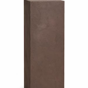 May include: A tall, rectangular pedestal with a dark brown, matte finish and a textured, plaster-like surface. The structure features clean, sharp edges and a flat top, standing vertically as a solid, singular display column for objects.