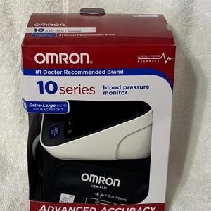 May include: An Omron 10 Series blood pressure monitor in its original red and white packaging. The box features the text #1 Doctor Recommended Brand, Advanced Accuracy, and shows the device with a black cuff and white monitor unit with a screen.