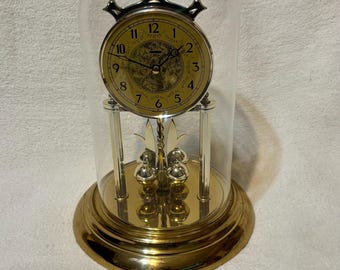 Reloj de aniversario Huller alemán vintage de los años 90, de cuarzo, con cúpula, de metal dorado.