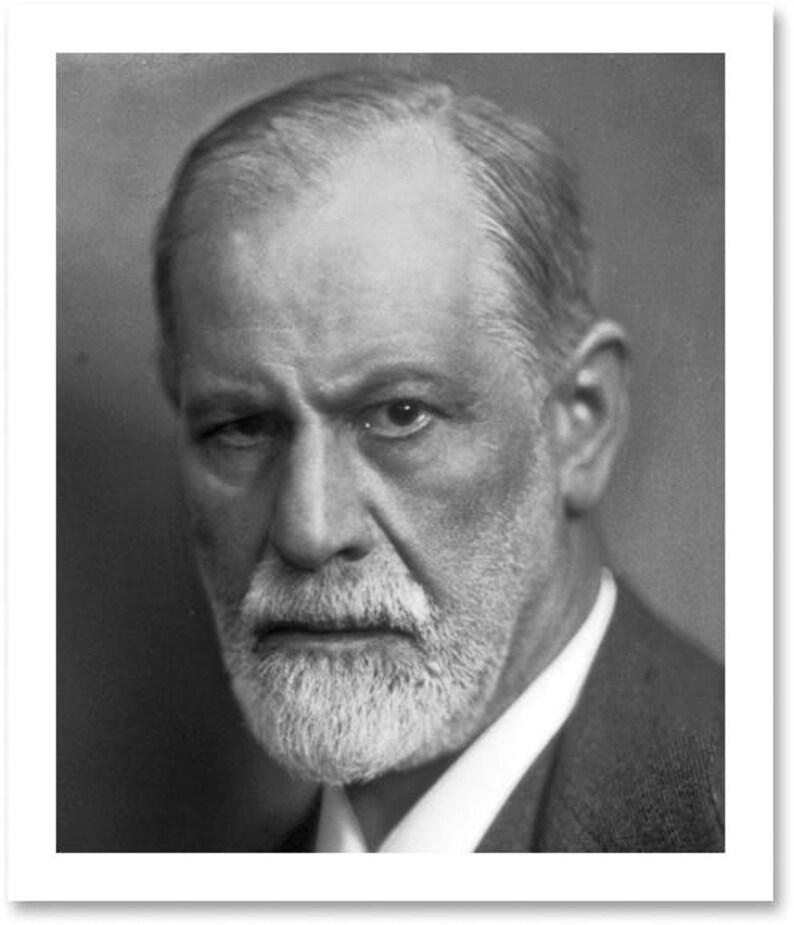 May include: Black and white portrait of a man with a white beard and a serious expression. He is wearing a suit and tie. The image is a close-up of his face.