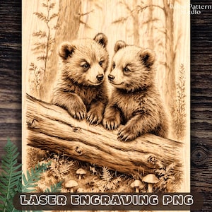 May include: Laser engraved wooden art piece featuring two adorable bear cubs perched on a log. The artwork is detailed with a forest background and mushrooms. The text "LASER ENGRAVING PNG" is at the bottom.